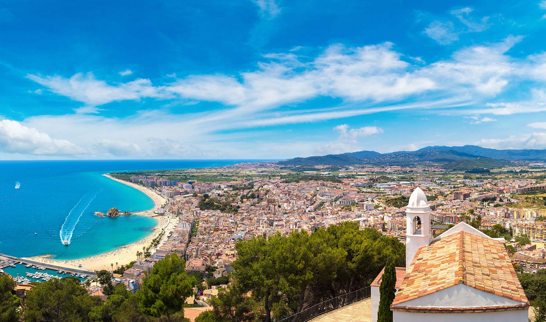 Panoramic aerial view of Blanes in Costa Brava in a beautiful summer day, Spain